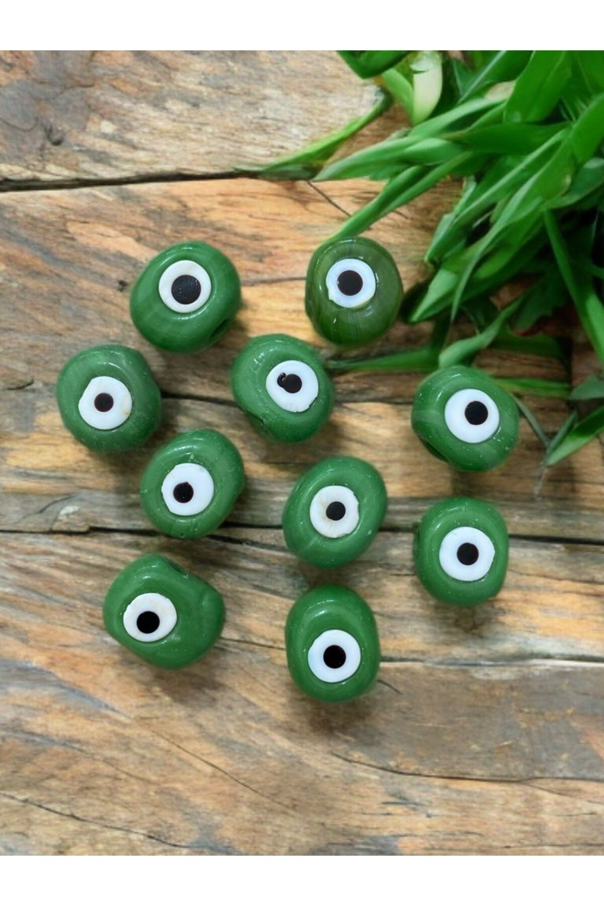 Home 10 Adet Yeşil Danagöz Delikli Cam Nazar Boncuğu. El Yapımı. Ebat 1,5 cm ~ 2,5 cm Arası.