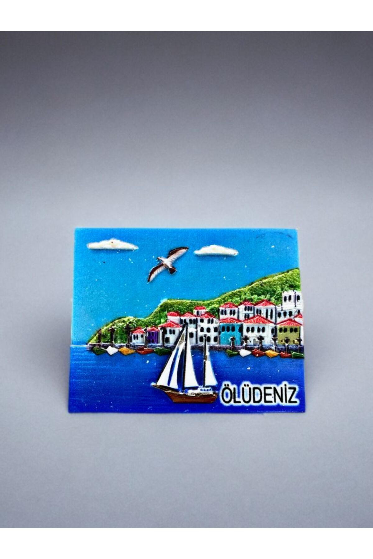 Home ÖLÜDENİZ Temalı Kabartma Polyester Magnet. 8cm x 7 cm.