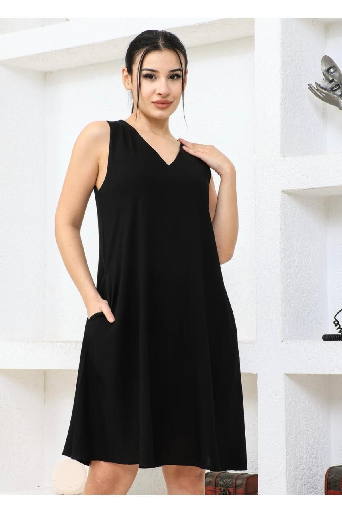 MODA KOLSUZ SİYAH RAHAT ELBİSE