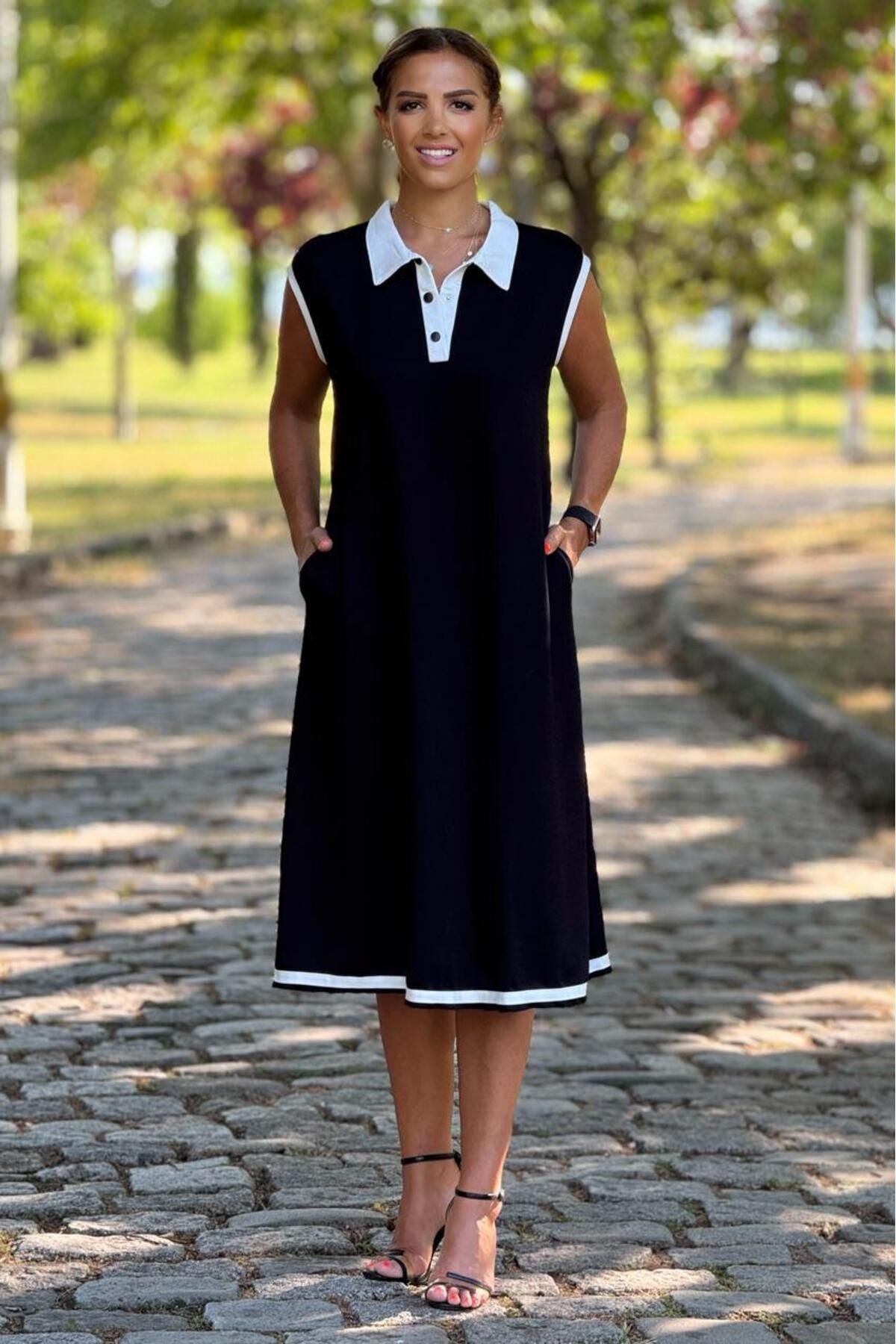 Nevin Kaya Moda Siyah Kolsuz Etekleri ve Yakası Beyaz Elbise