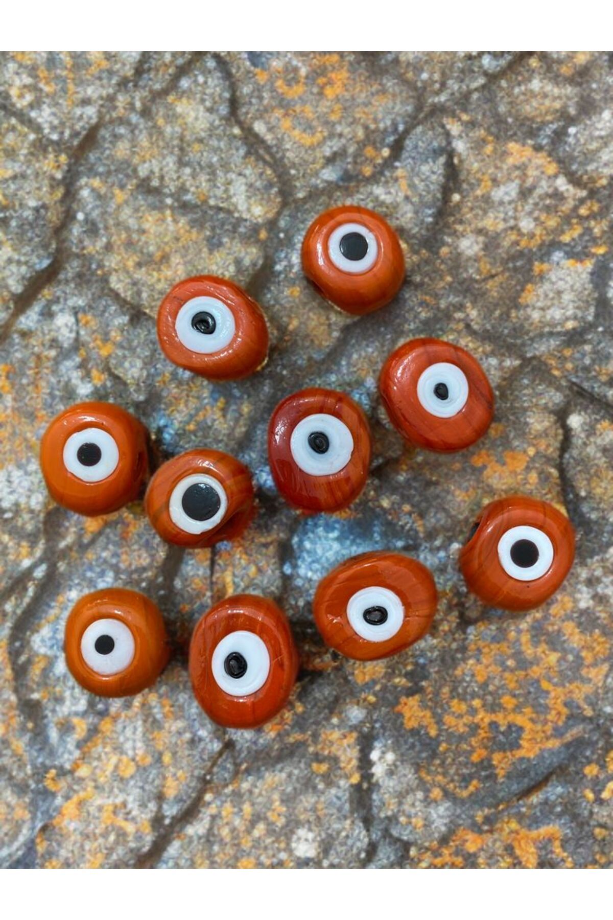Home 10 Adet Turuncu Danagöz Delikli Cam Nazar Boncuğu. El Yapımı. Ebat 1,5 cm ~ 2,5 cm Arası.