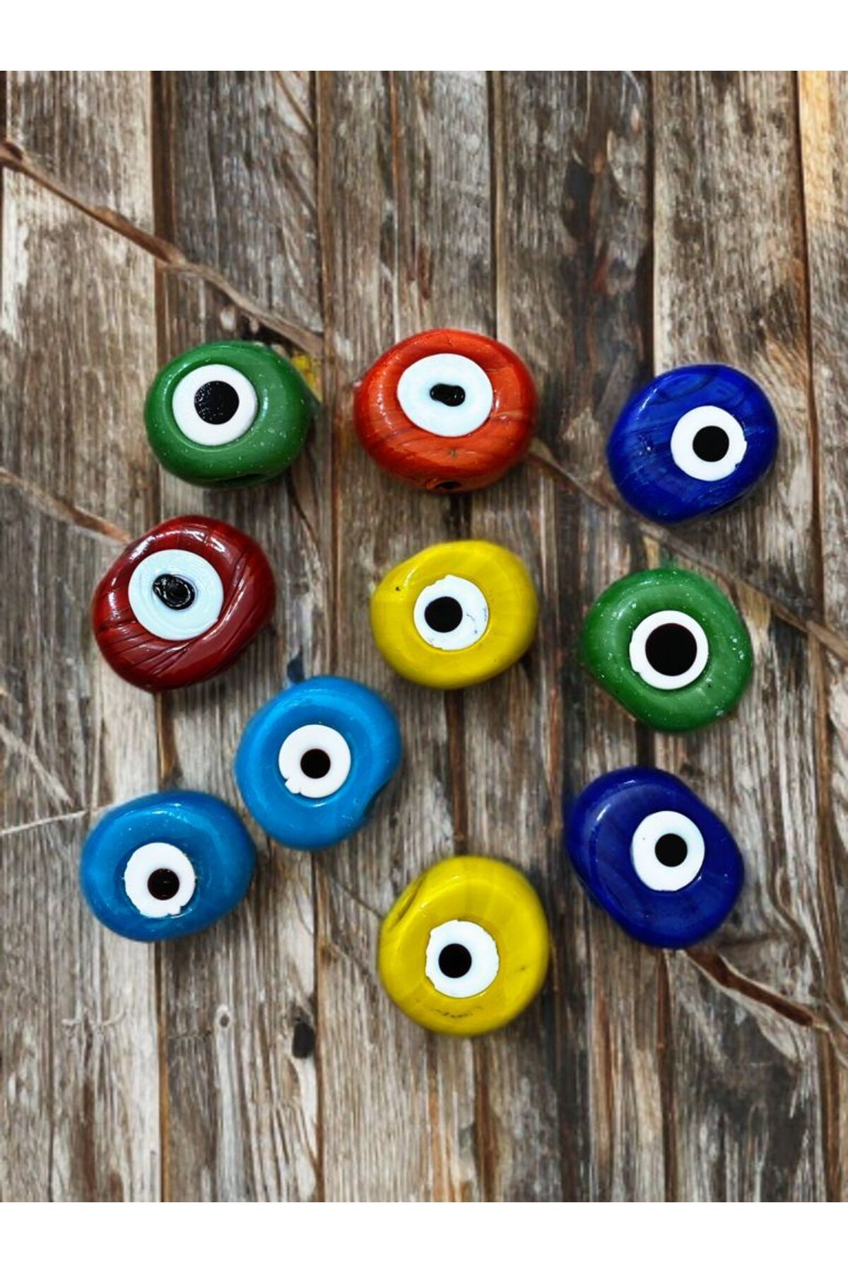 Home 10 Adet Karışık Renk Danagöz Delikli Cam Nazar Boncuğu. El Yapımı. Ebat 1,5 cm ~ 2,5 cm Arası.