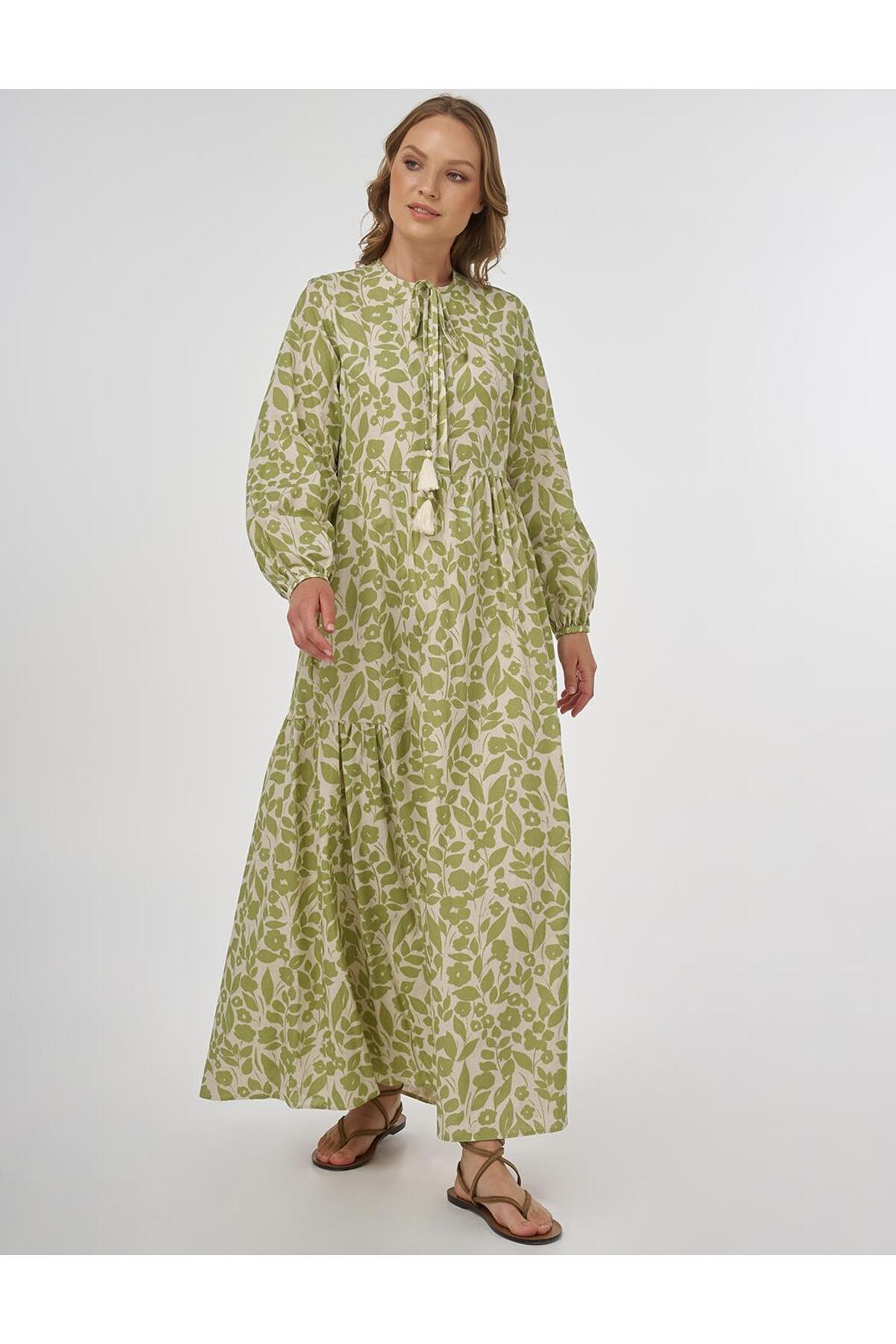 لباس مجلسی نخی طرح گلدار ماکسی به رنگ سبز پسته ای Kayra