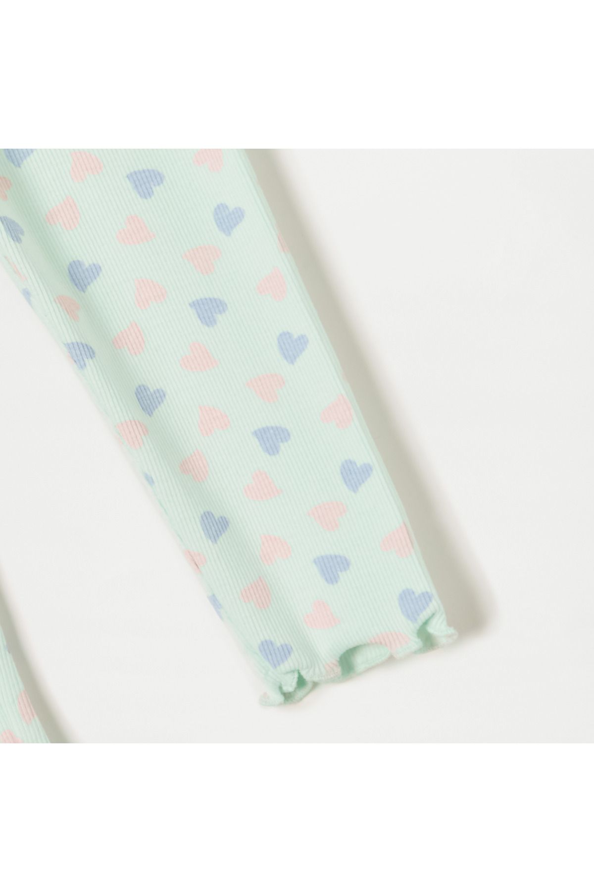 Juniors-All-Over Heart Print Leggings with Lettuce Hem and Button Accent 4