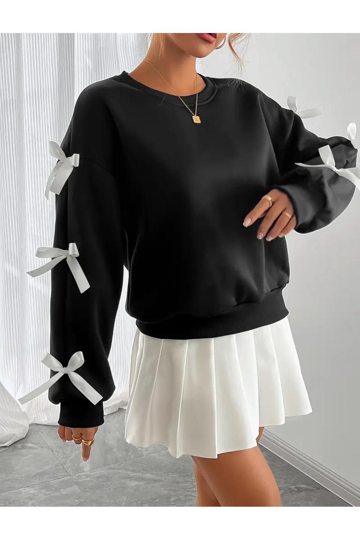 caddekombin Dámská černá mikina s bílou stuhou a mašlí na rukávech a výstřihem do V