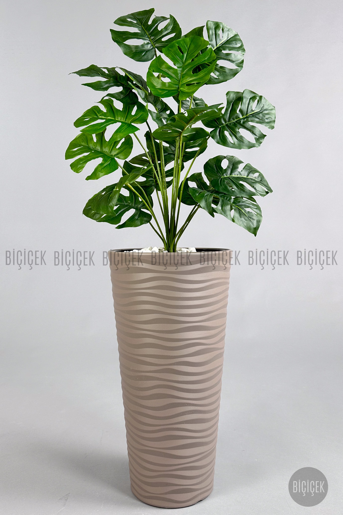 Artificial Flower Lounge Plant Monstera Camel Base in Beige Beach Pot