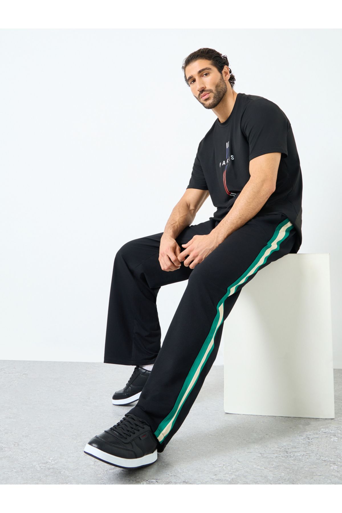 Styli-Relaxed Fit Open Hem Joggers with Side Tape and Badge Detail 1