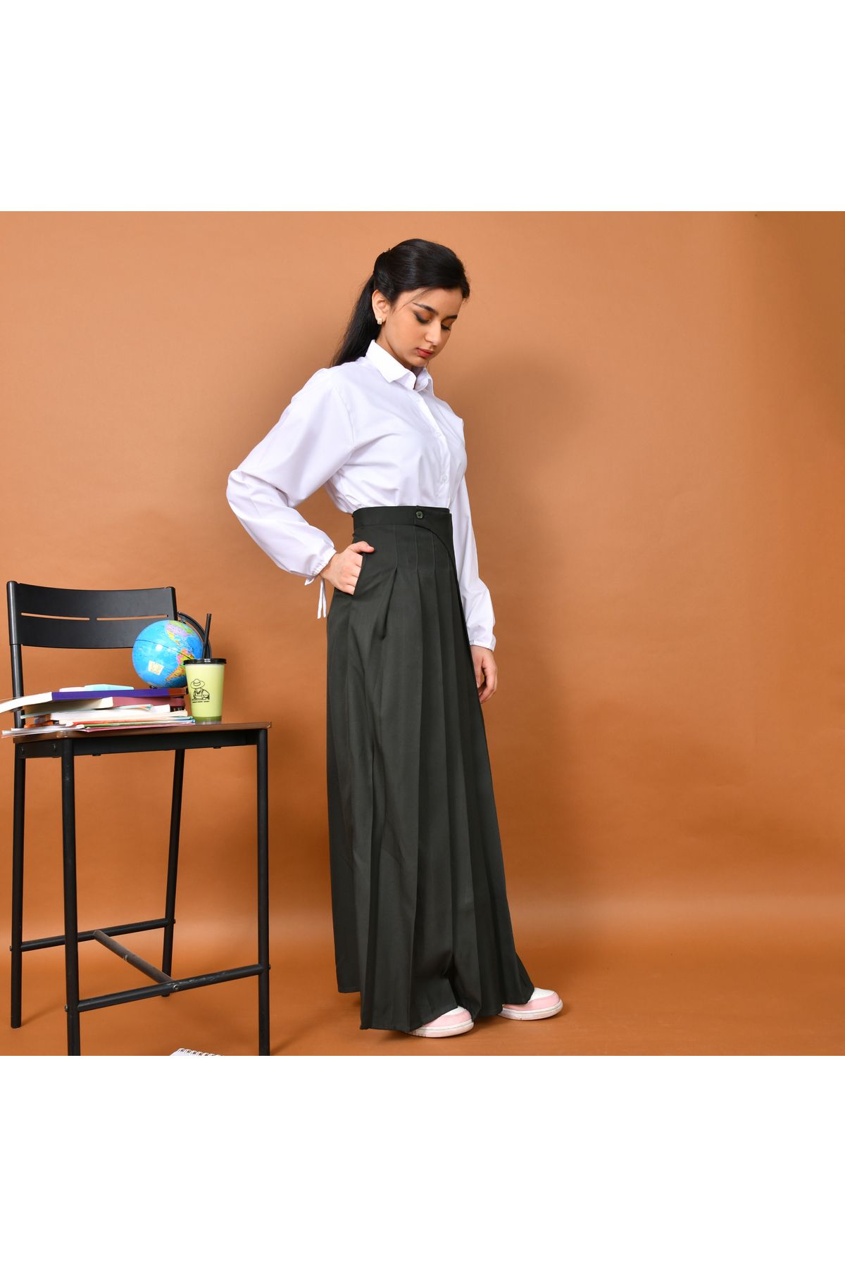 HAWRAA-A distinctively designed skirt with wide pleats and a side cut decorated with a button and hidden pockets (olive) 3