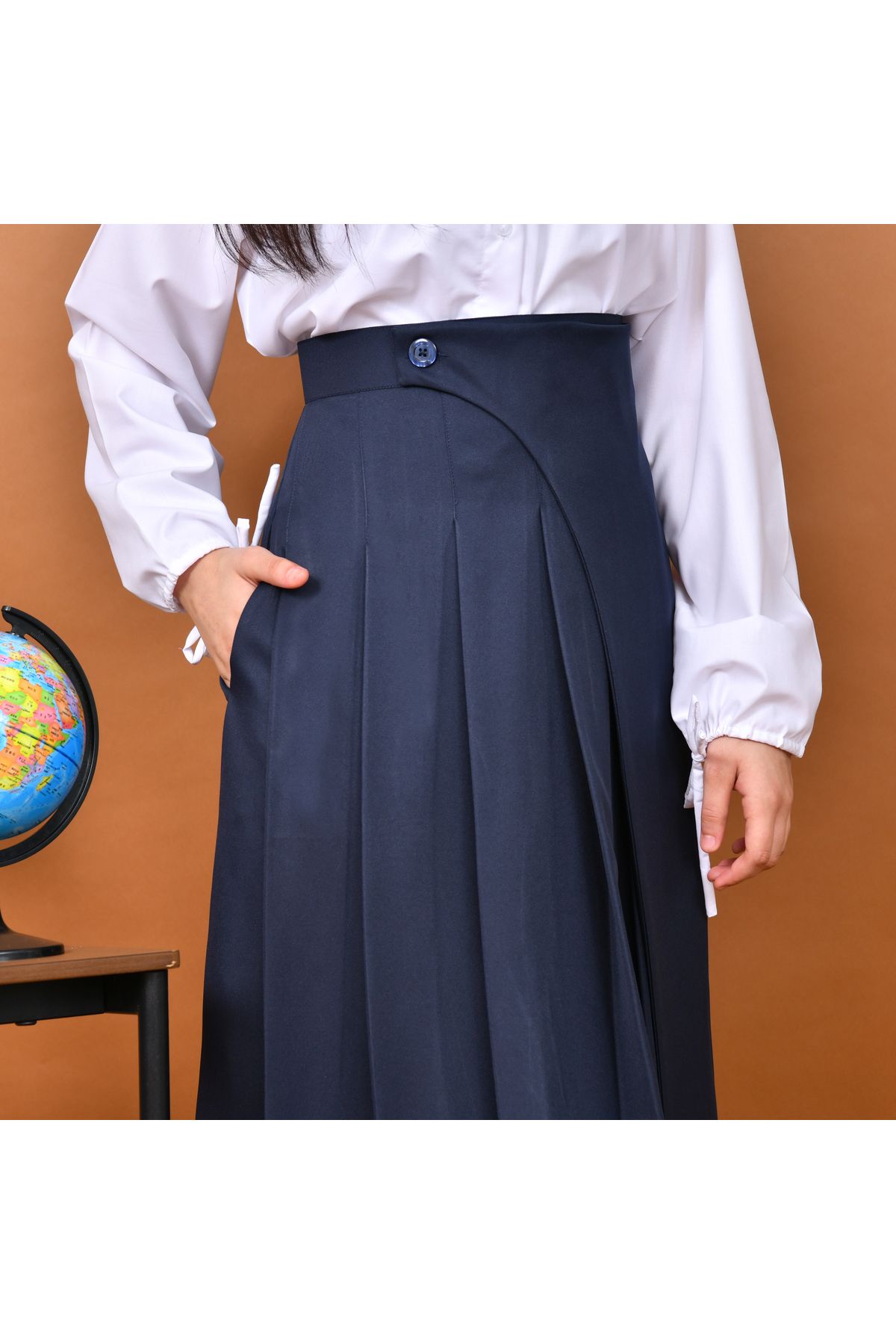 HAWRAA-A distinctively designed skirt with wide pleats and a side cut decorated with a button with hidden pockets (navy blue) 2