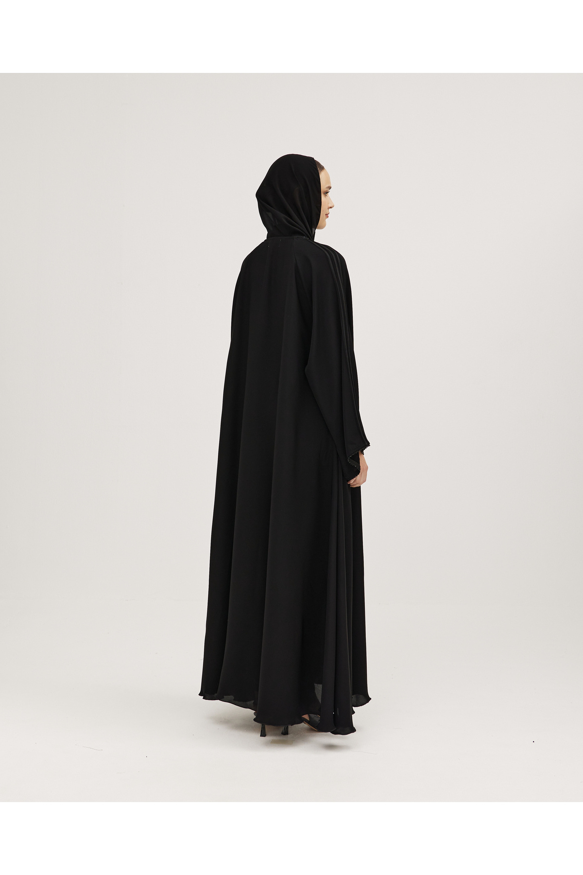 SOROSE-Black double-layered Internet abaya decorated with vertical lines and black studs on the sleeves 1