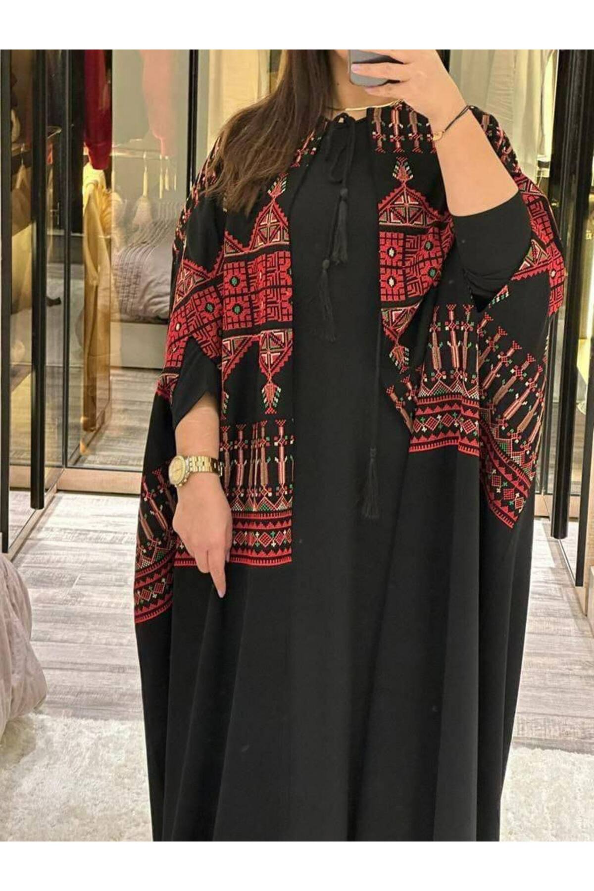 جلابية نسائية فاخرة بتطريز ذهبي أنيق بلون أخضر زمردي من ليالي الجلابية