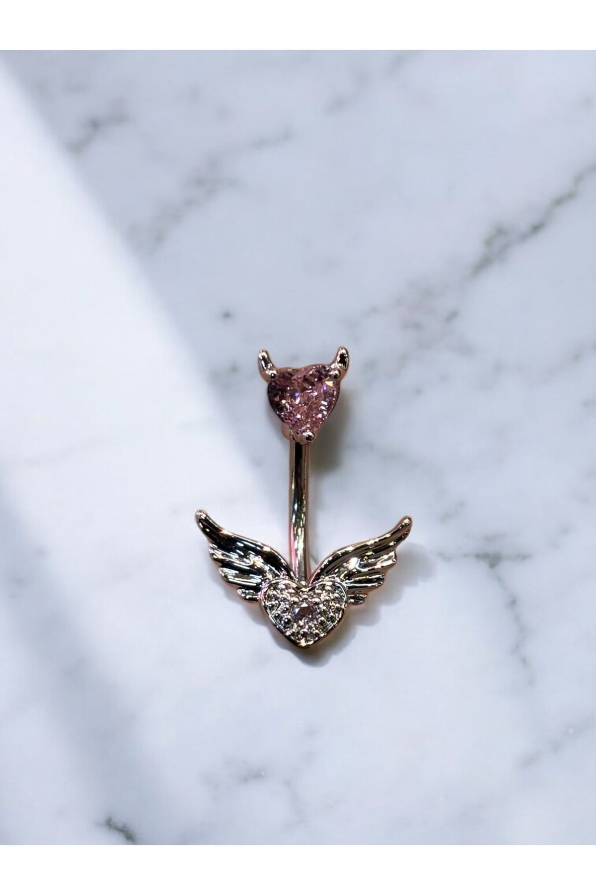 Takayrum-Belly Piercing with Steel Heart and Wing Detail 1