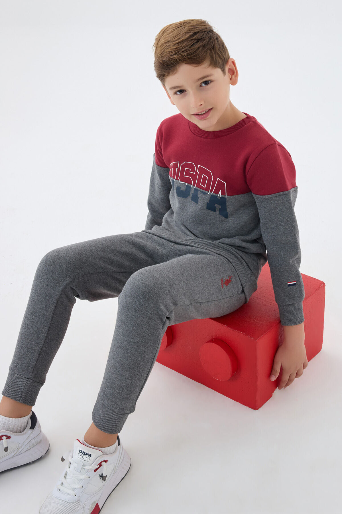 یو اس پولو لباس ورزشی پسرانه زرشکی یو اس پولو لباس ورزشی پسرانه زرشکی