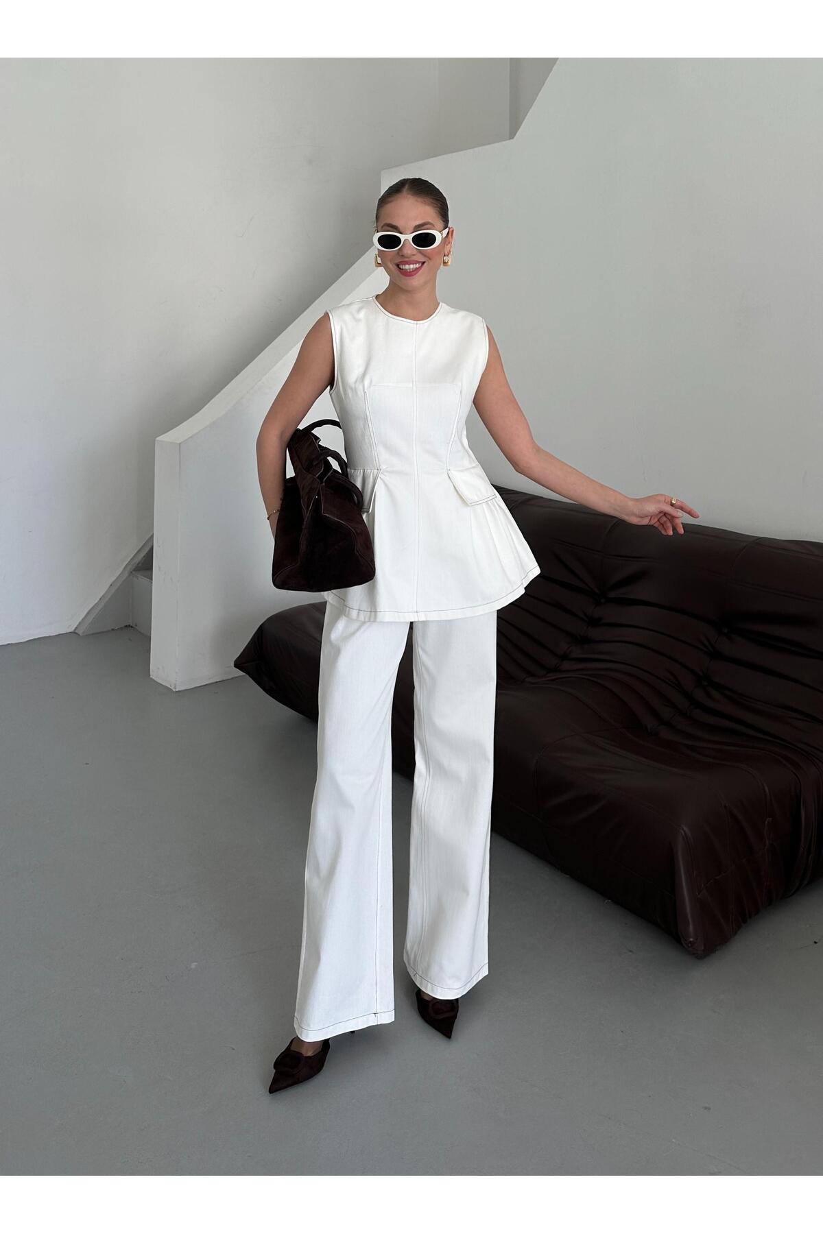 Laluvia Biały zestaw bluzki i spodni Leandra Design