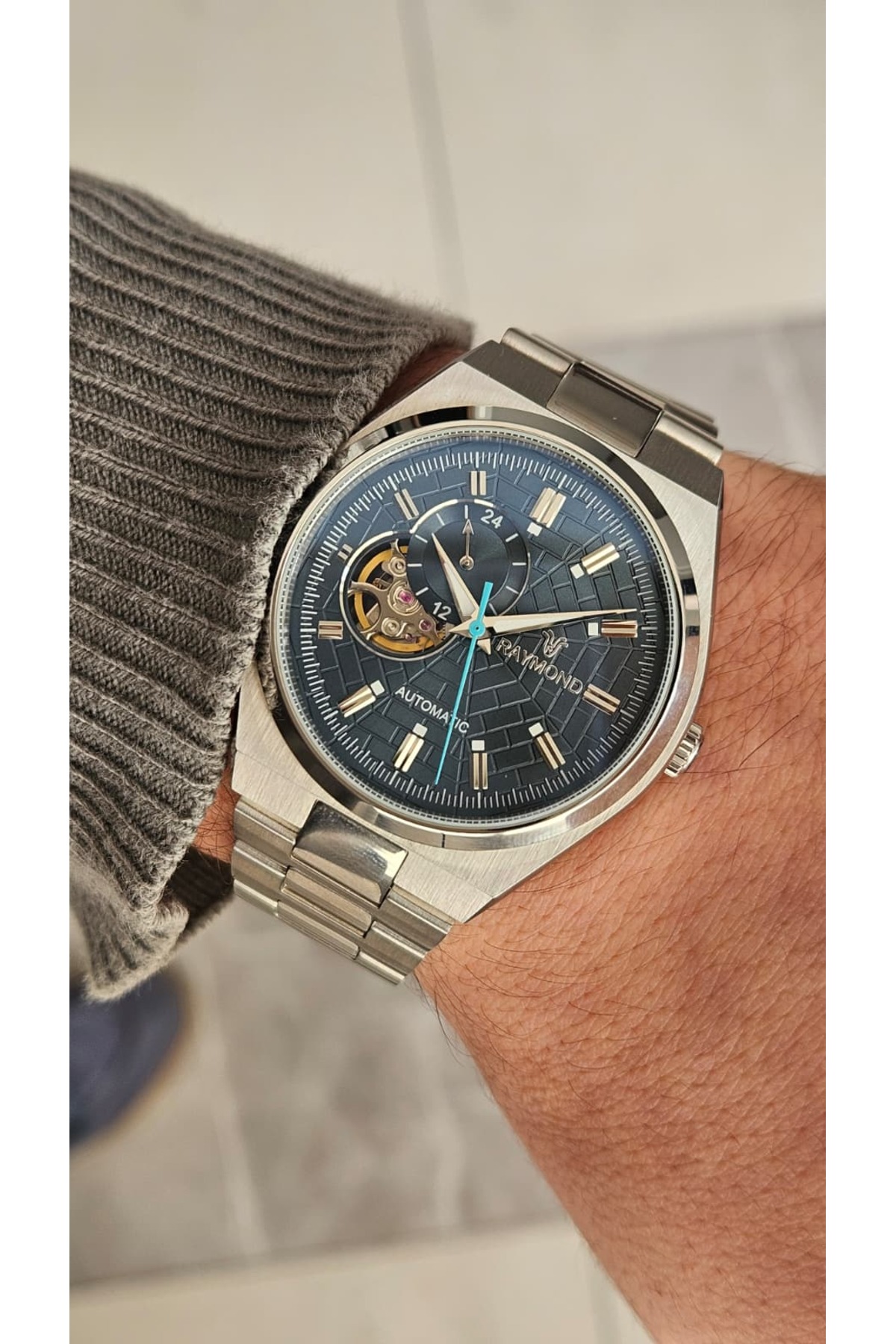 Raymond RYM-250424 ERKEK OTOMATİK SAAT - PASLANMAZ ÇELİK VE SAFİR
