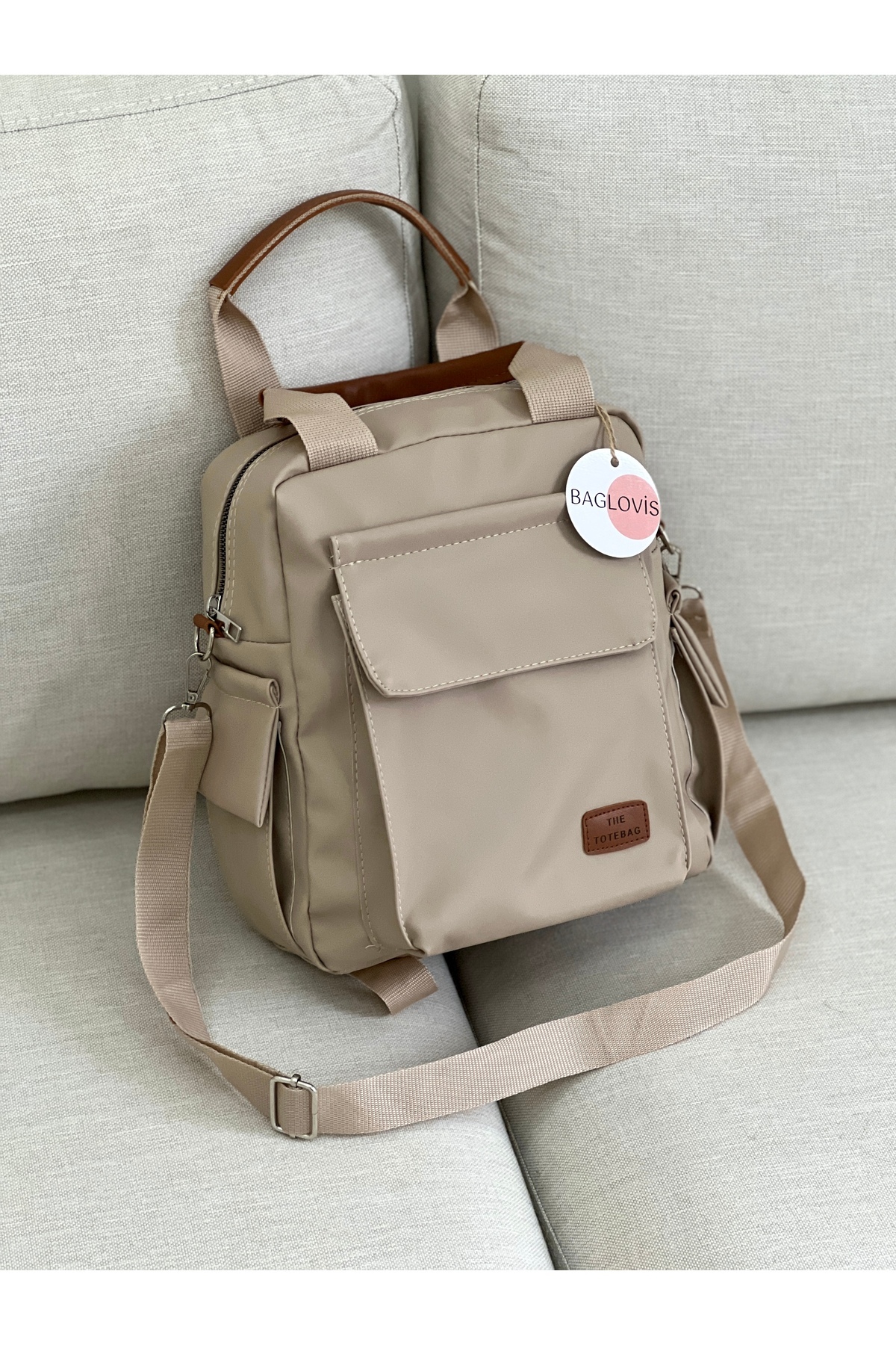 BAGLOVİS  YANLARI VE ÖNÜ CEP DETAYLI VİZON KADIN SIRT ÇANTASI