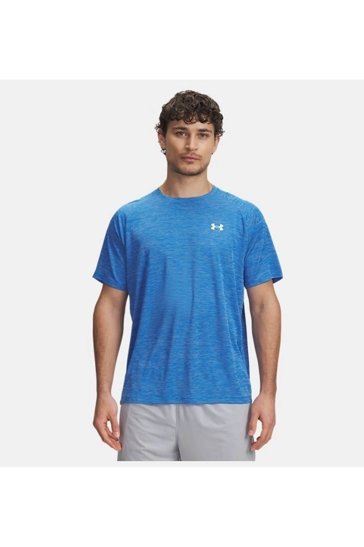 آندر آرمور تی شرت مردانه یو ای تک مدل بافت‌دار SS آبی - سفید کد ۱۳۸۲۷۹۶-۴۰۲