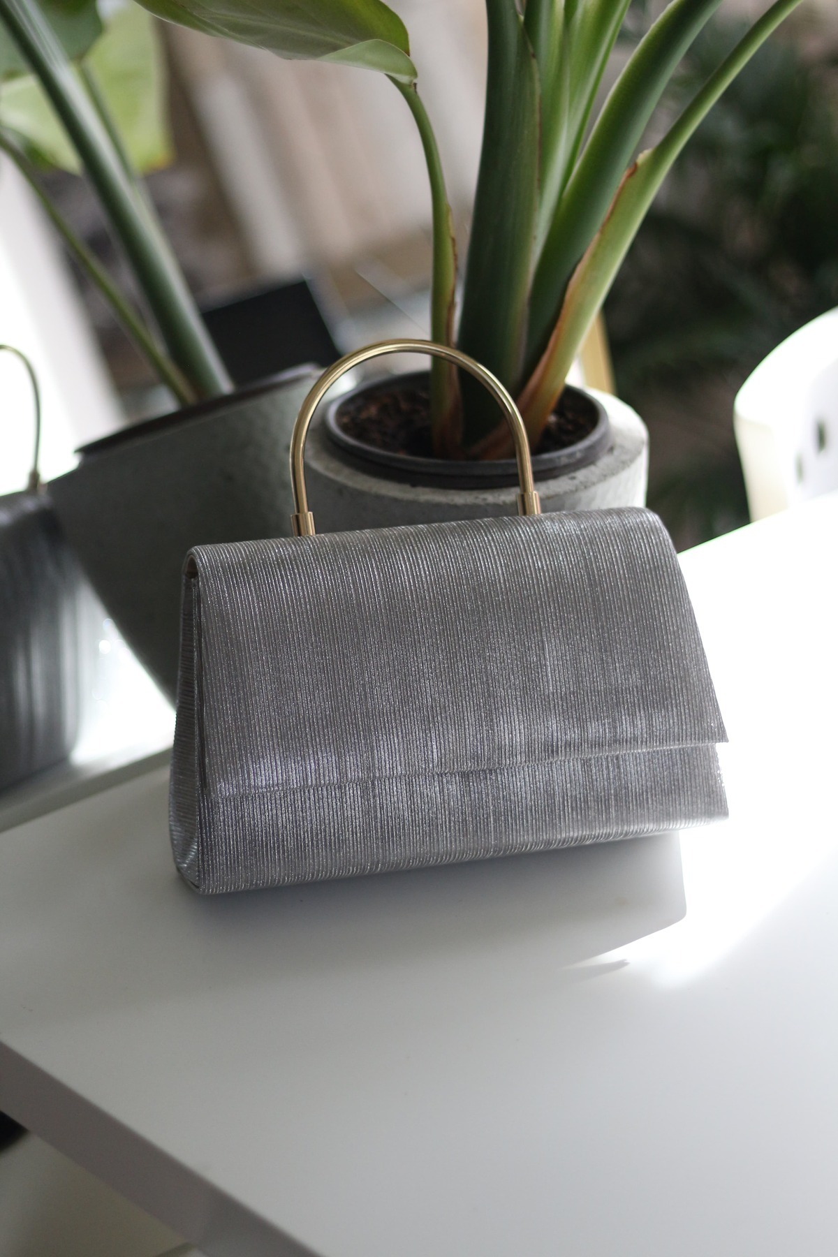 Women's Platinum Laser Cut Evening Bag with Metal Retention Handle Cover