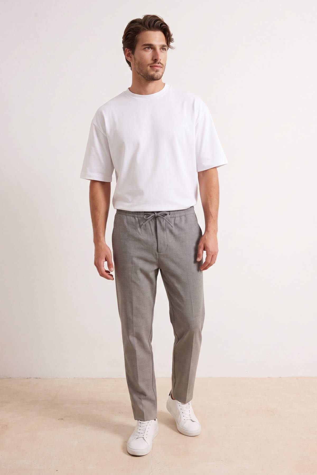 Trendyolmilla Man Gri Dar Kalıp/Straight Fit Dokulu Beli Lastikli Boru Paça Erkek Dokuma Pantolon TMNSS26PL00016