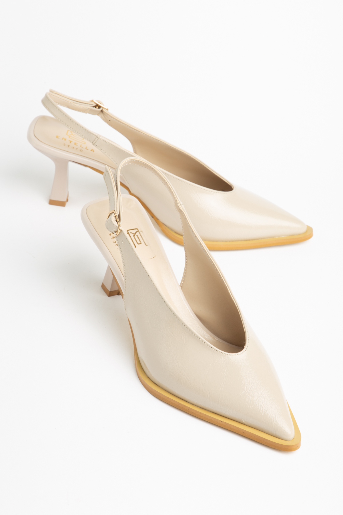 Short beige pointed heels with open back
