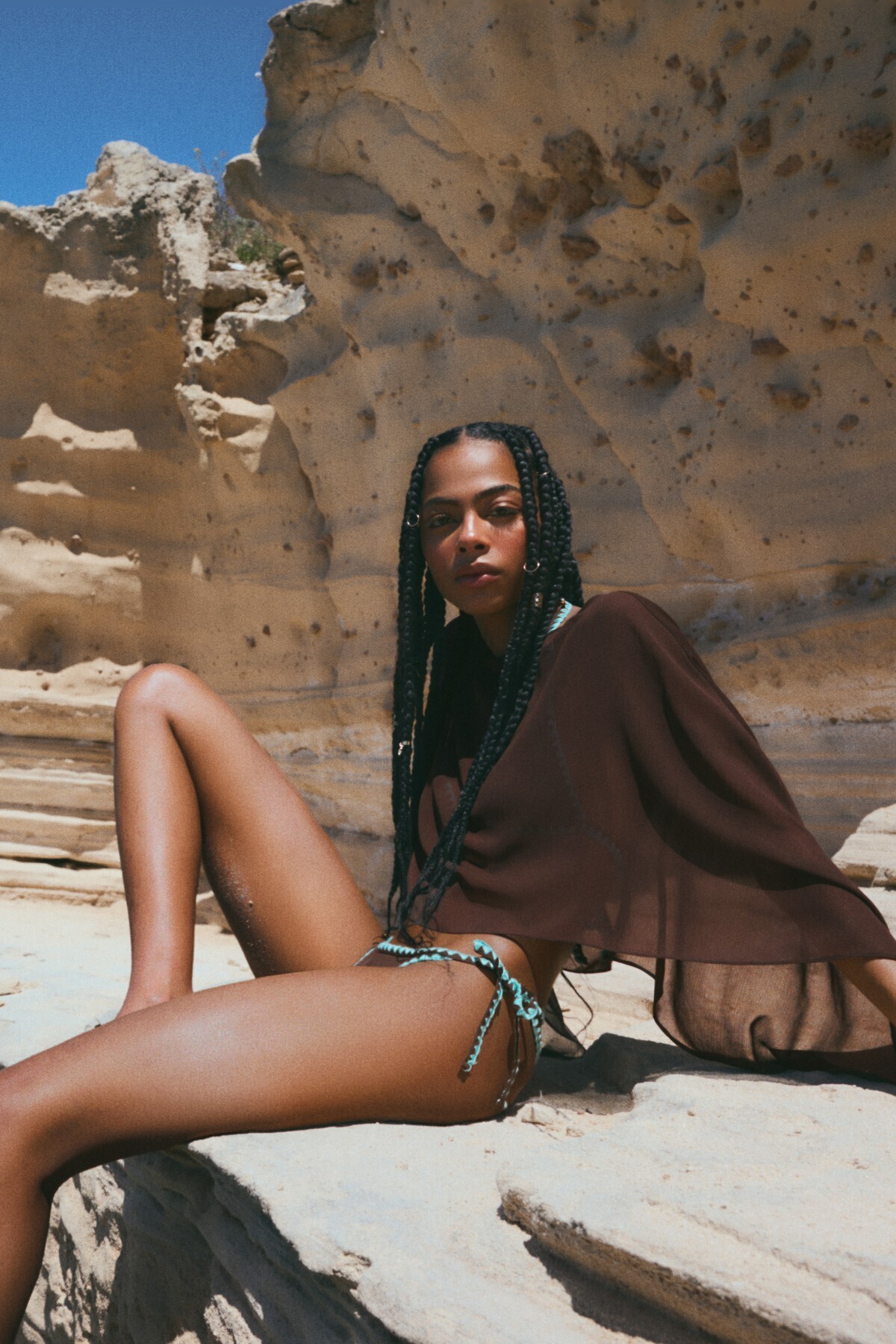 Asymmetrical semi-transparent draped cape