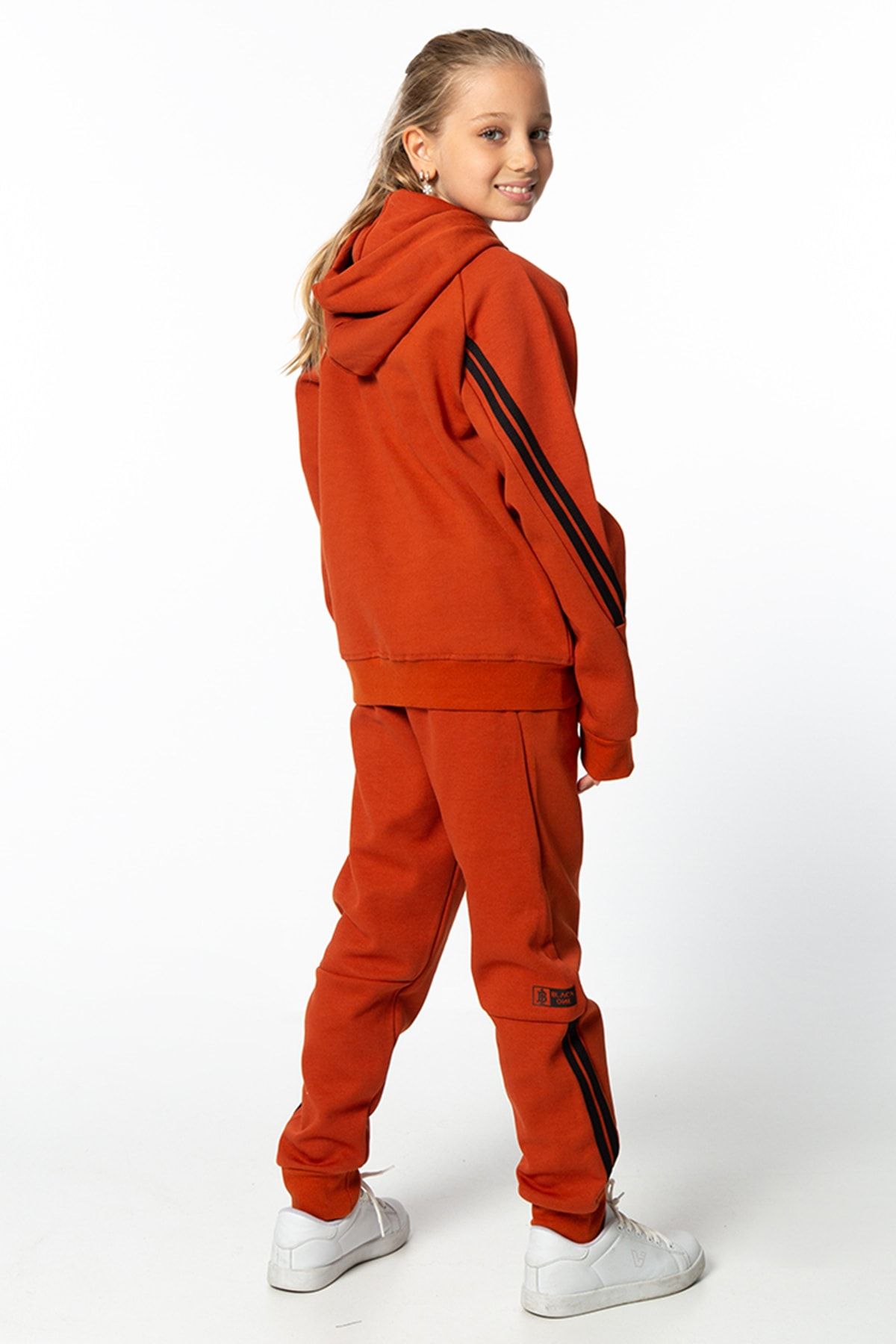Orange and black sweatsuit 2025