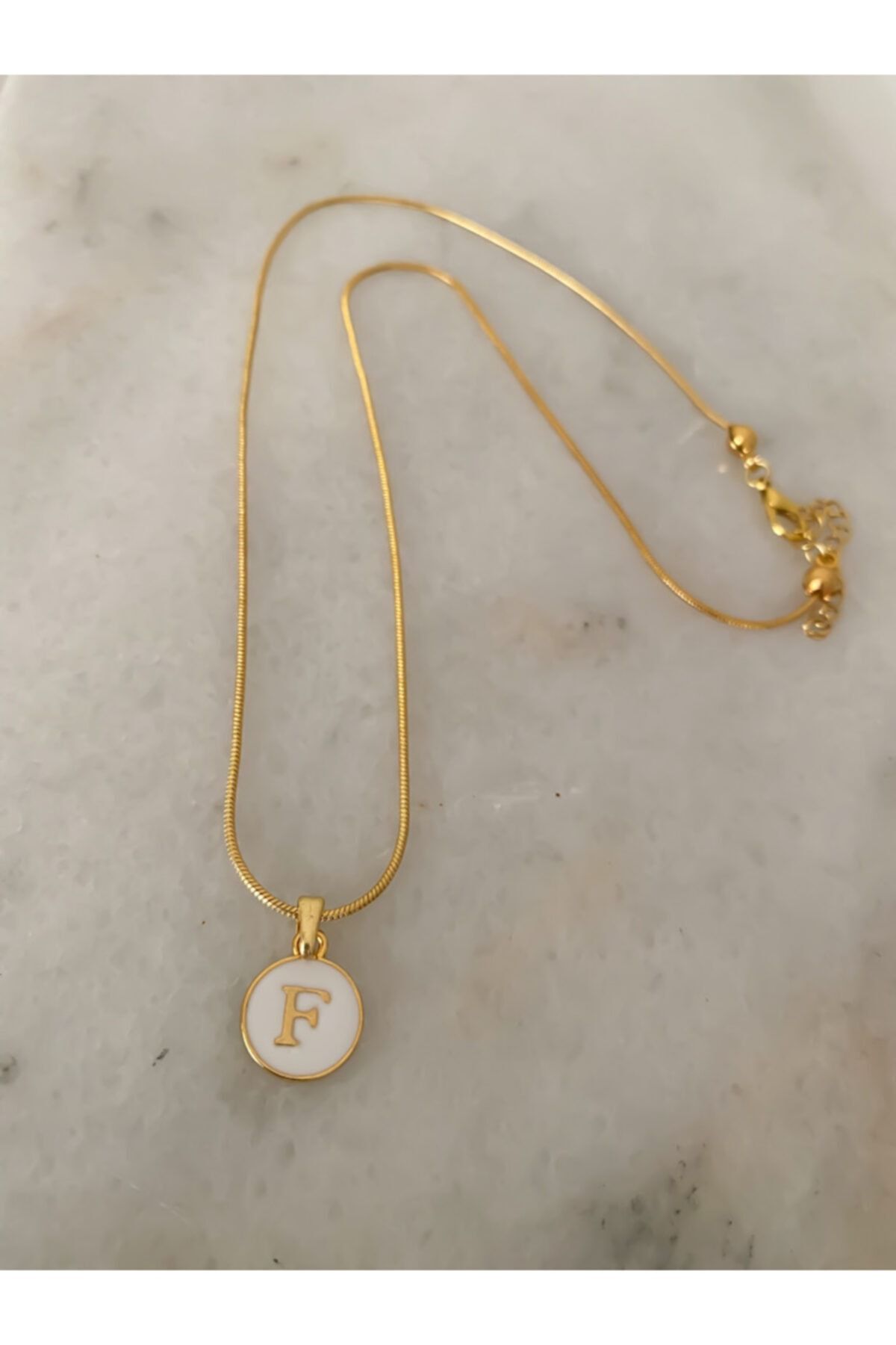 F pendant shop