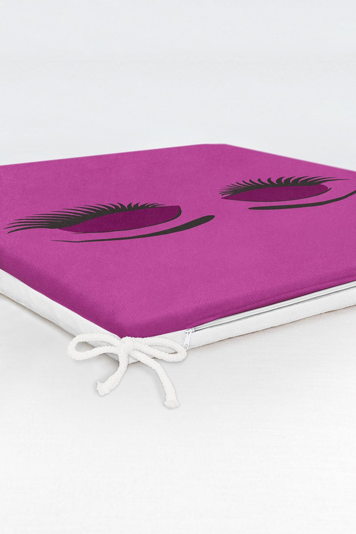 Realhomes-Zippered Chair Cushion with Eyelash Motif on Purple Floor 6