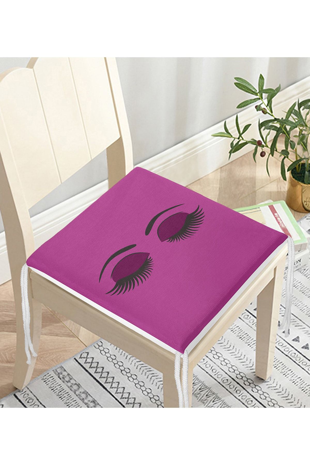 Realhomes-Zippered Chair Cushion with Eyelash Motif on Purple Floor 3