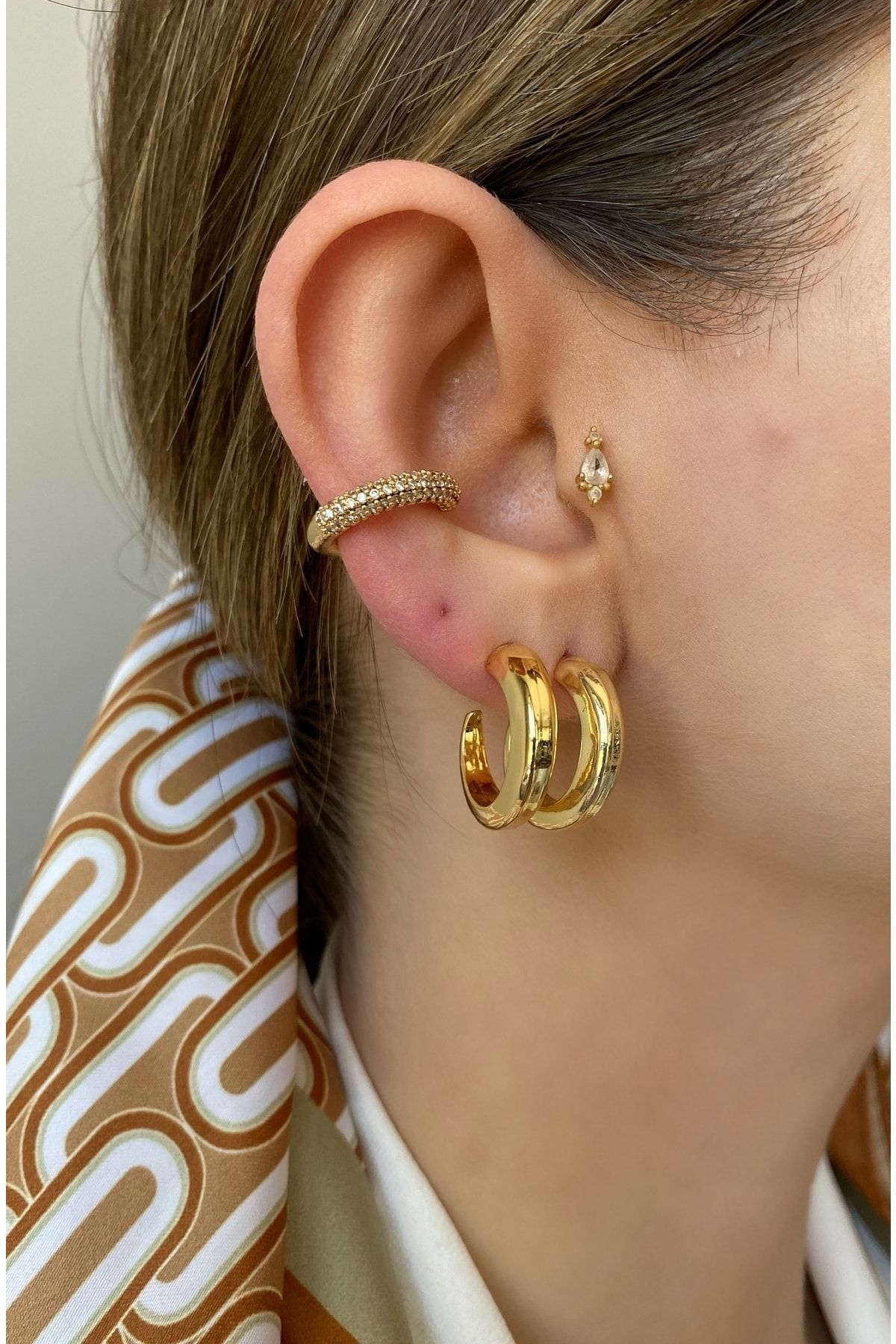 Gold top cartilage piercing