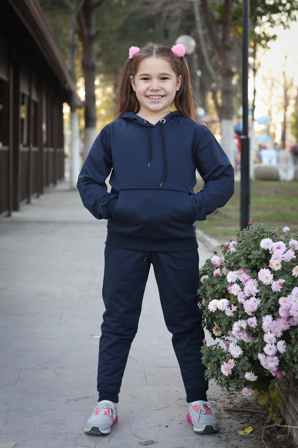 Girl wearing tracksuit discount