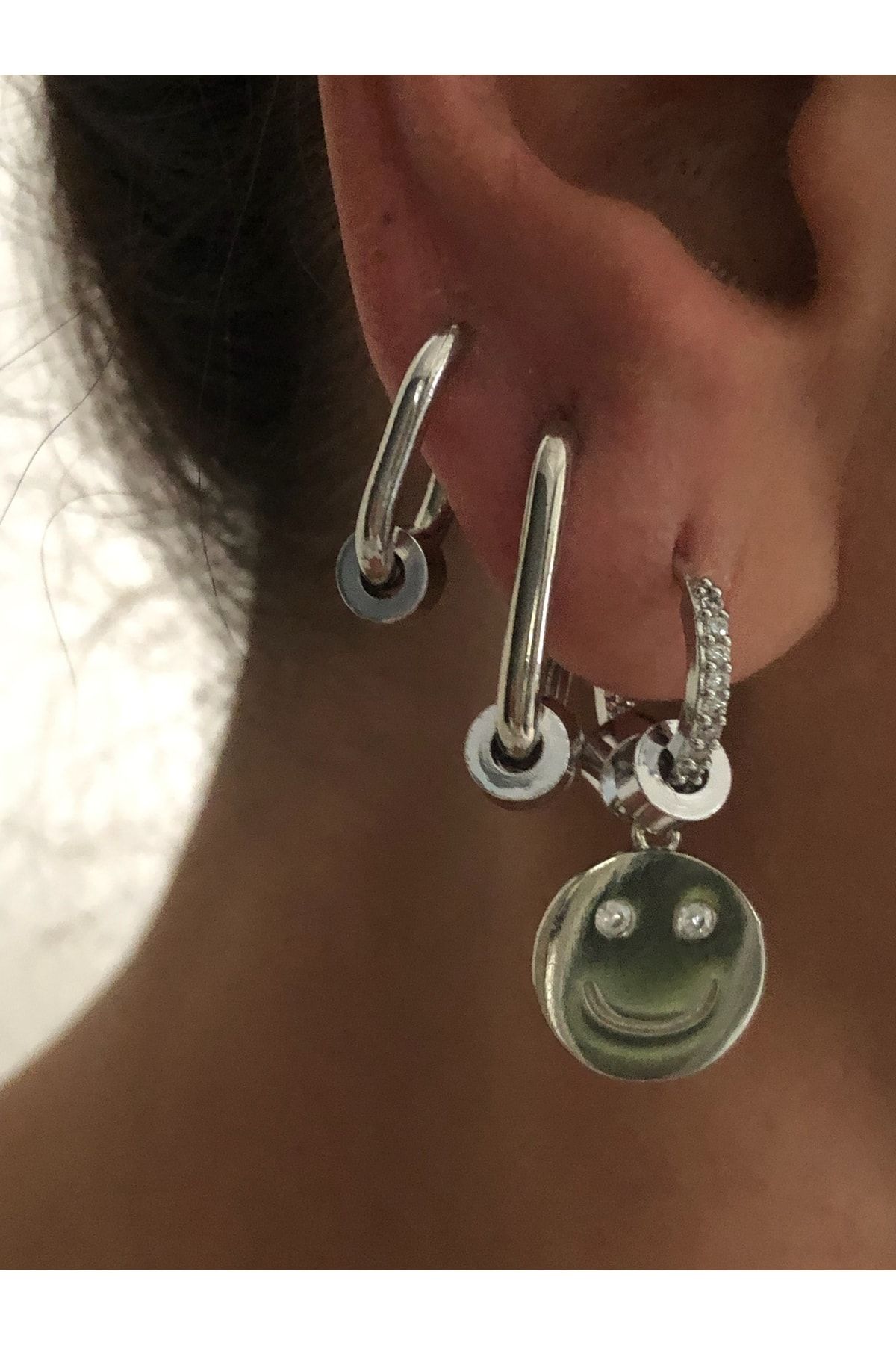 Earrings with best sale faces