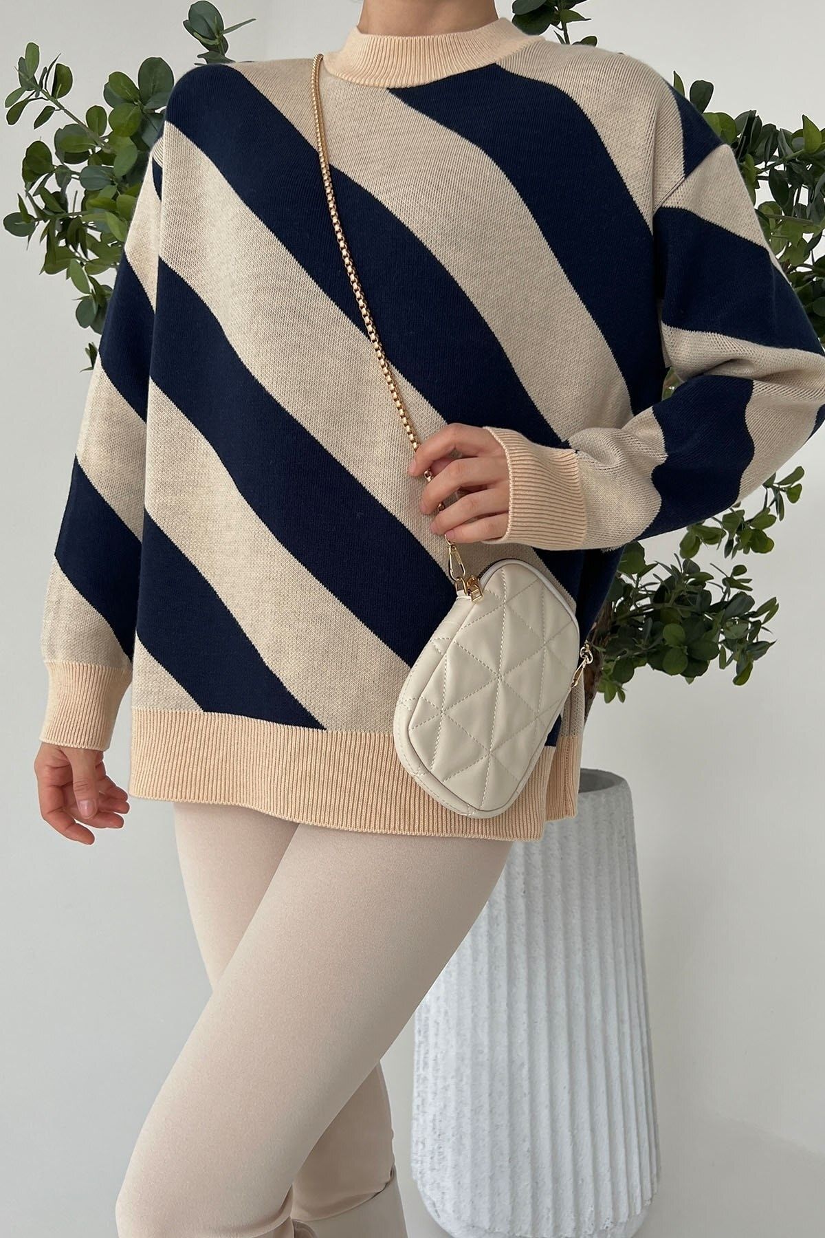 Asymmetrical outlet striped sweater