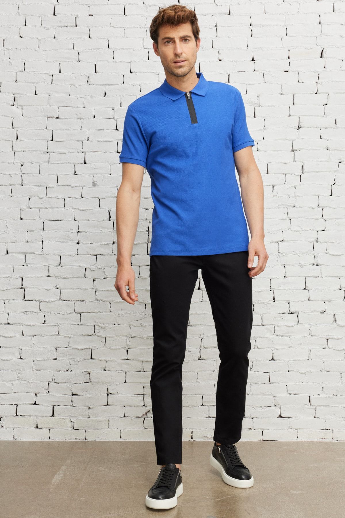 Black pants and polo shirt 2025