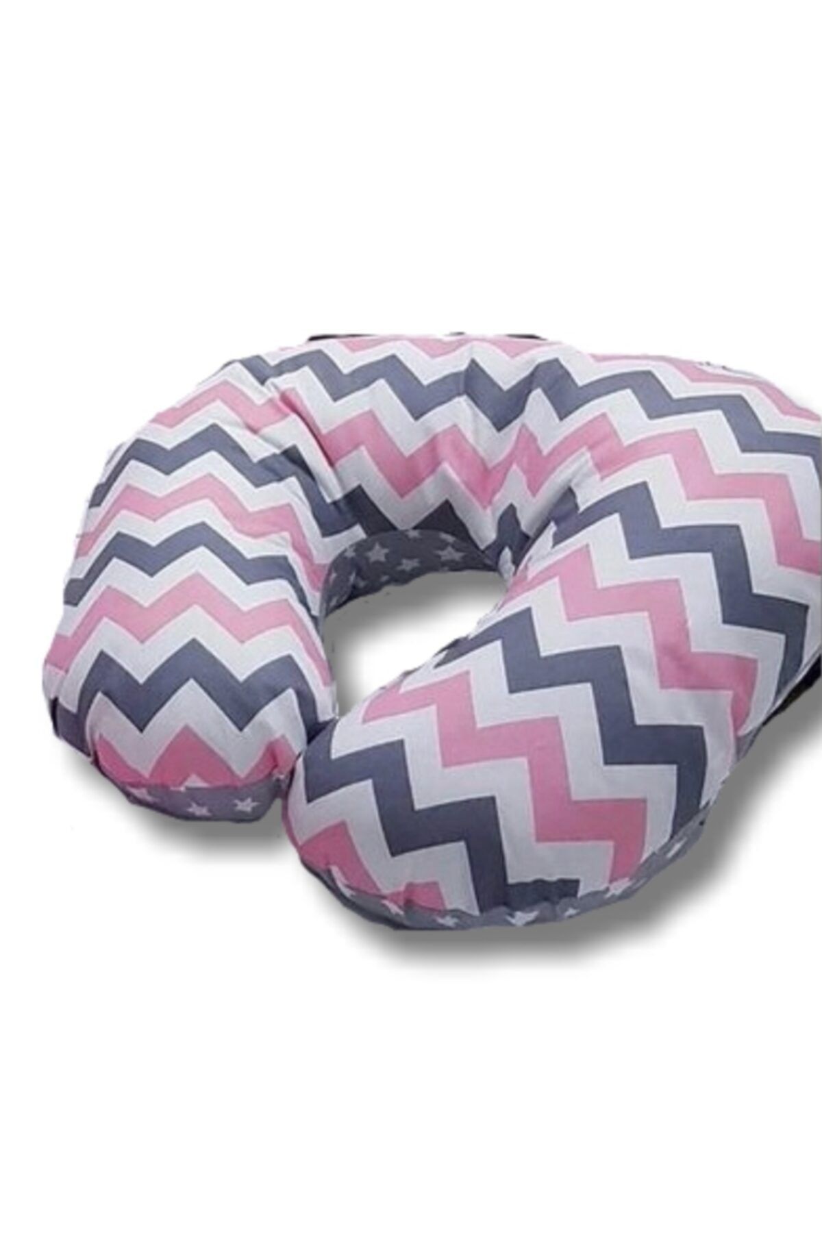 Pillow sitting on bed cheap