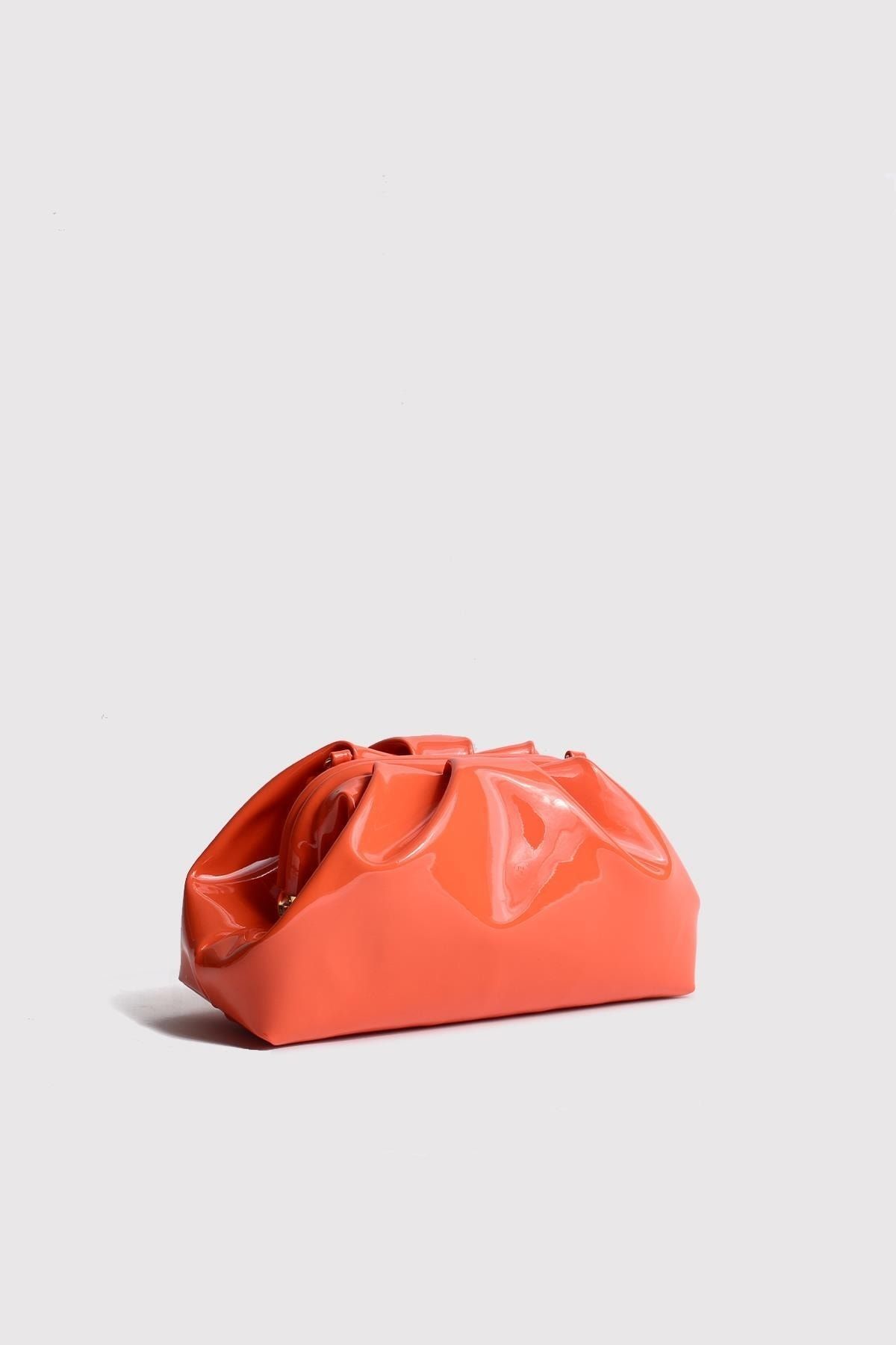 Orange patent hotsell clutch bag