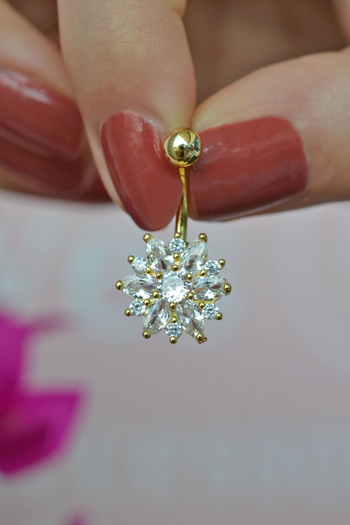 Flower belly top button piercing