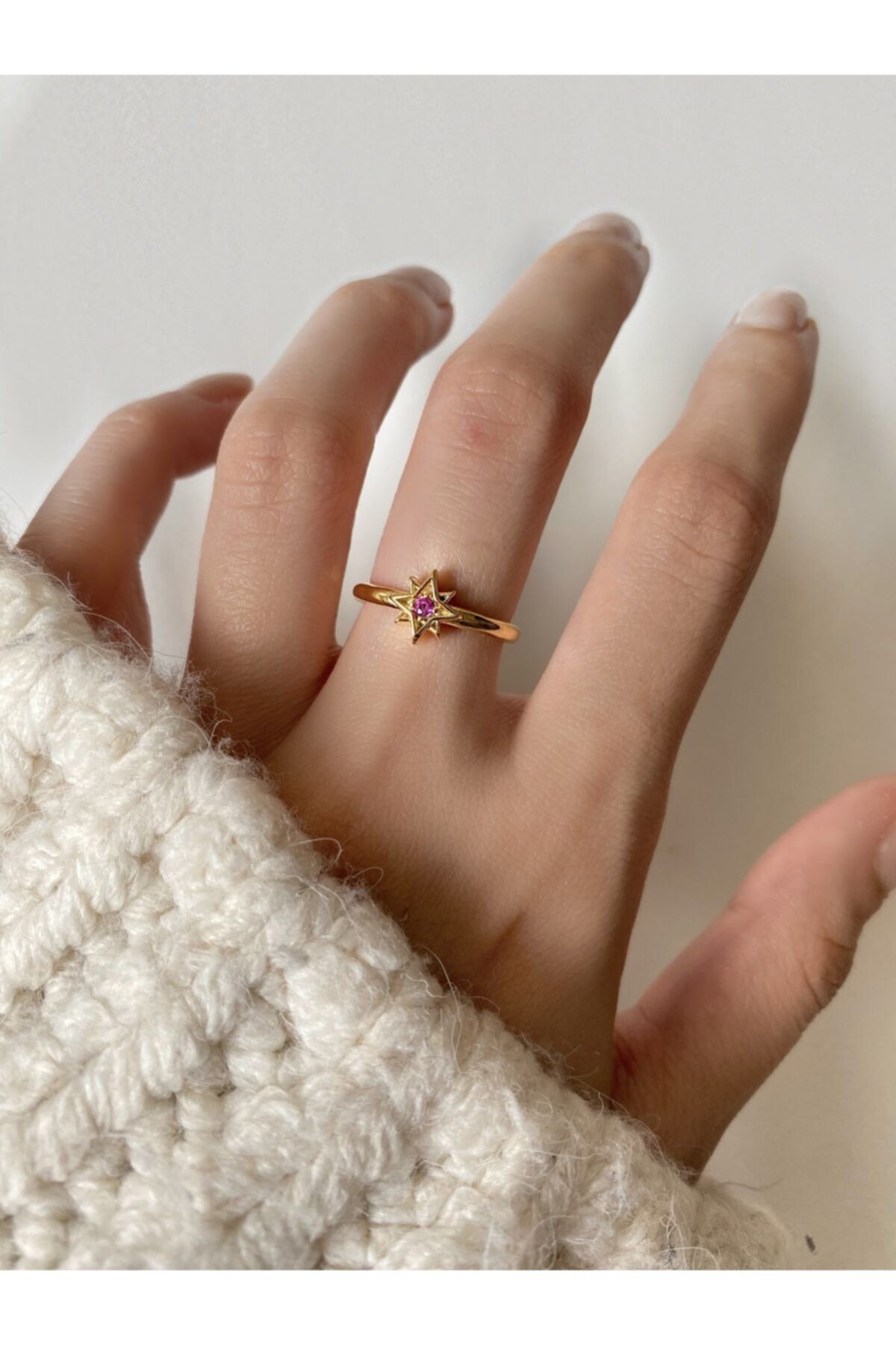 Gold ring deals with pink stone
