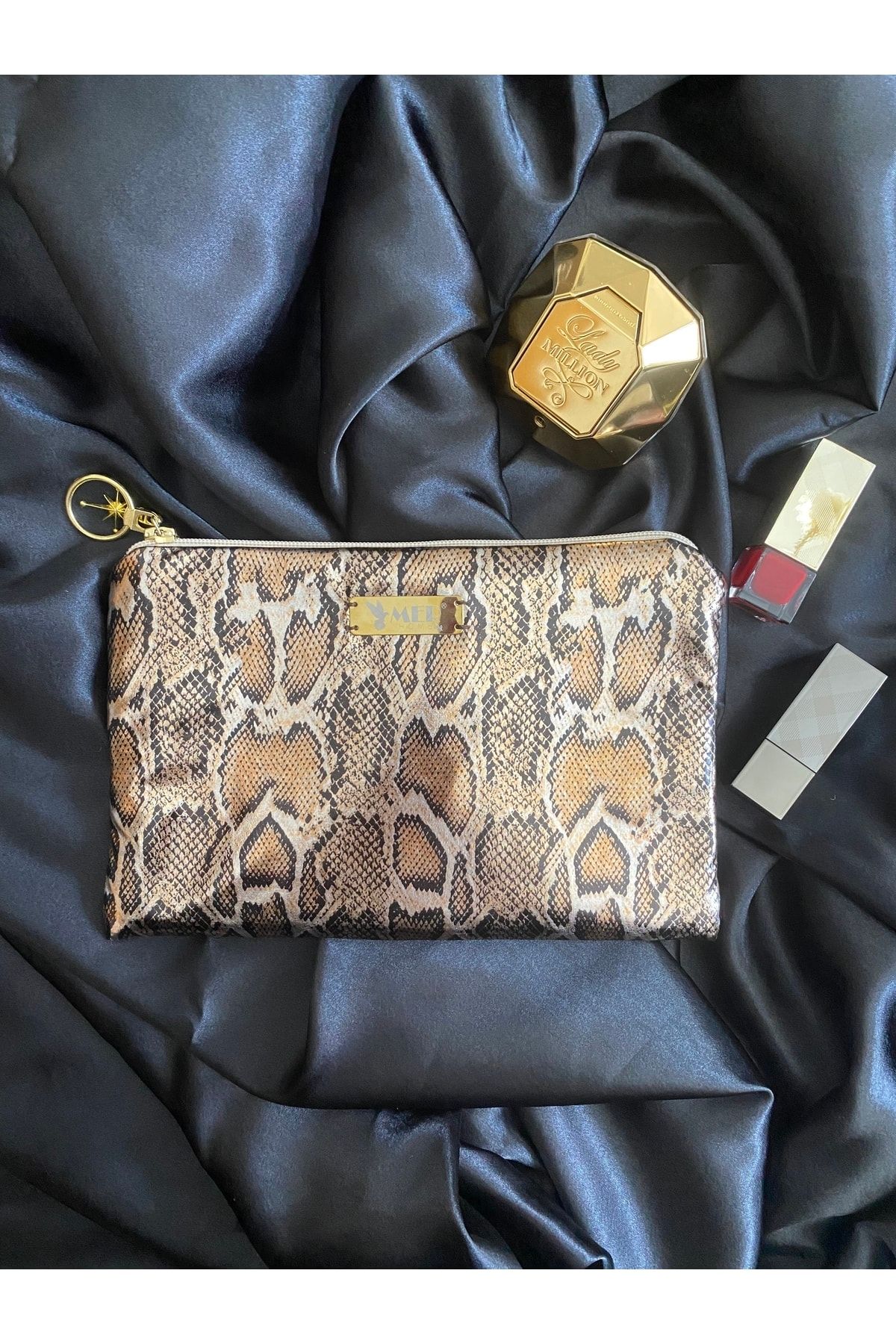 Gold snake print clutch bag deals