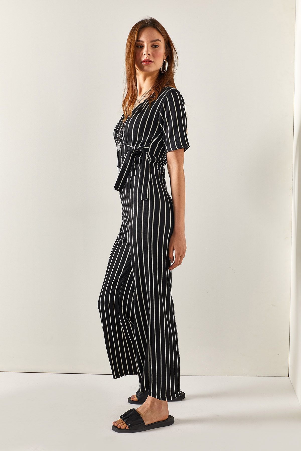 Vertical outlet striped jumpsuit
