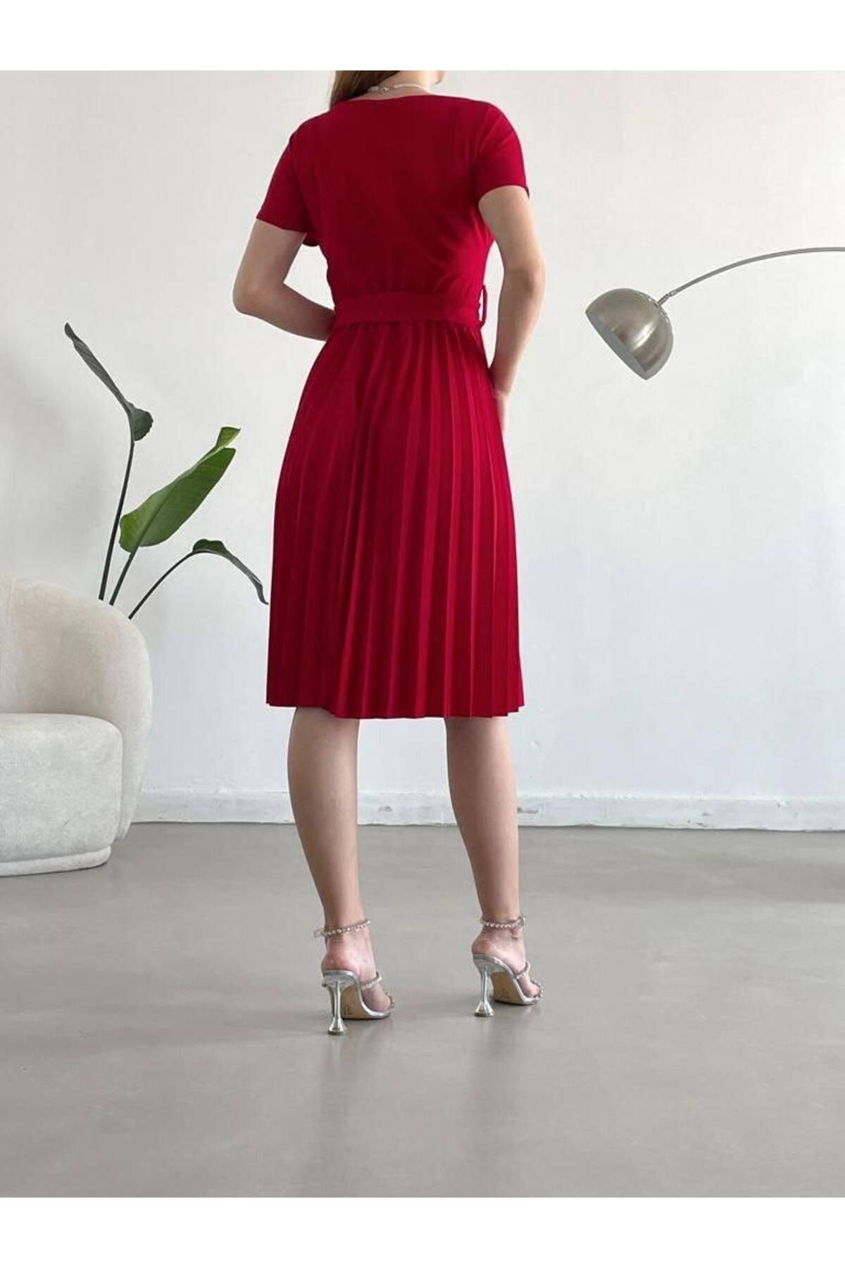 Pleated red shop wrap skirt