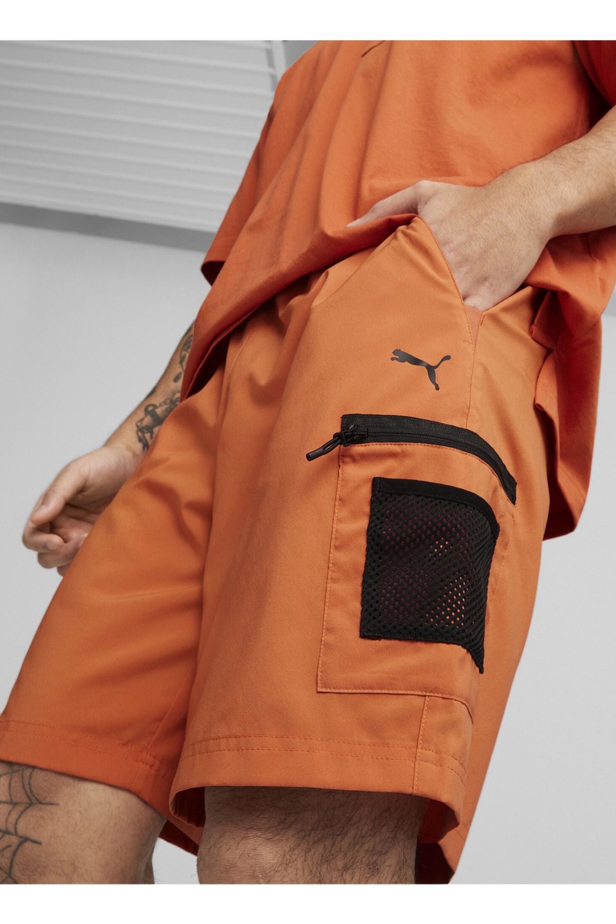Puma shorts mens orange discount