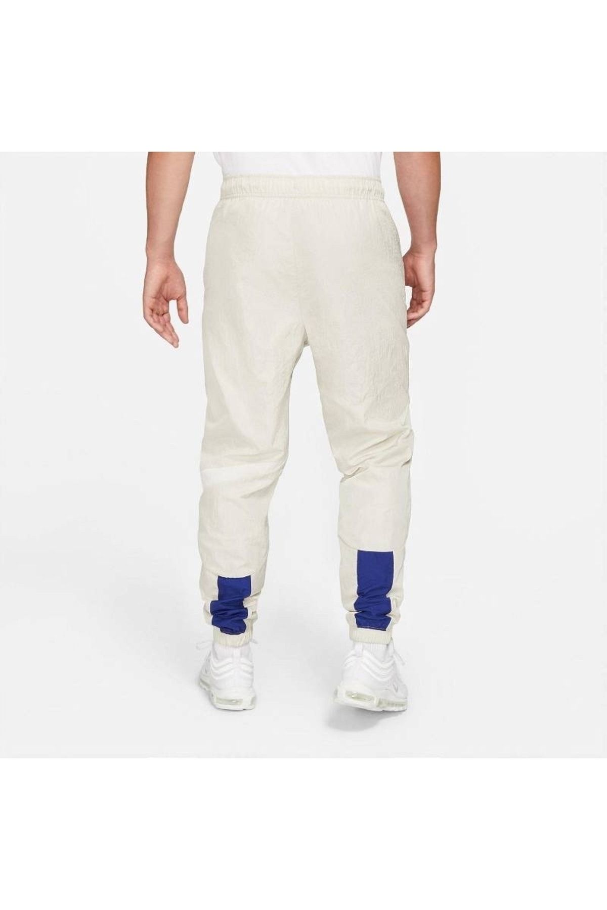 Nike Sportswear Swoosh Woven Lnd Men s Cream Sweatpants Trendyol