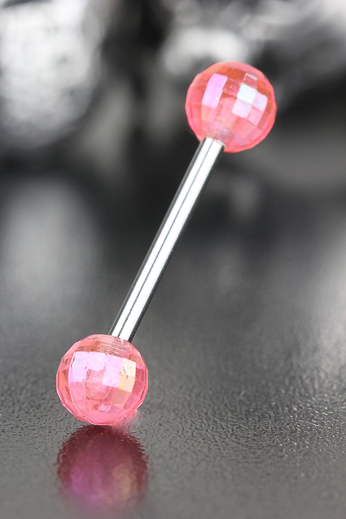 Pink tongue piercing on sale