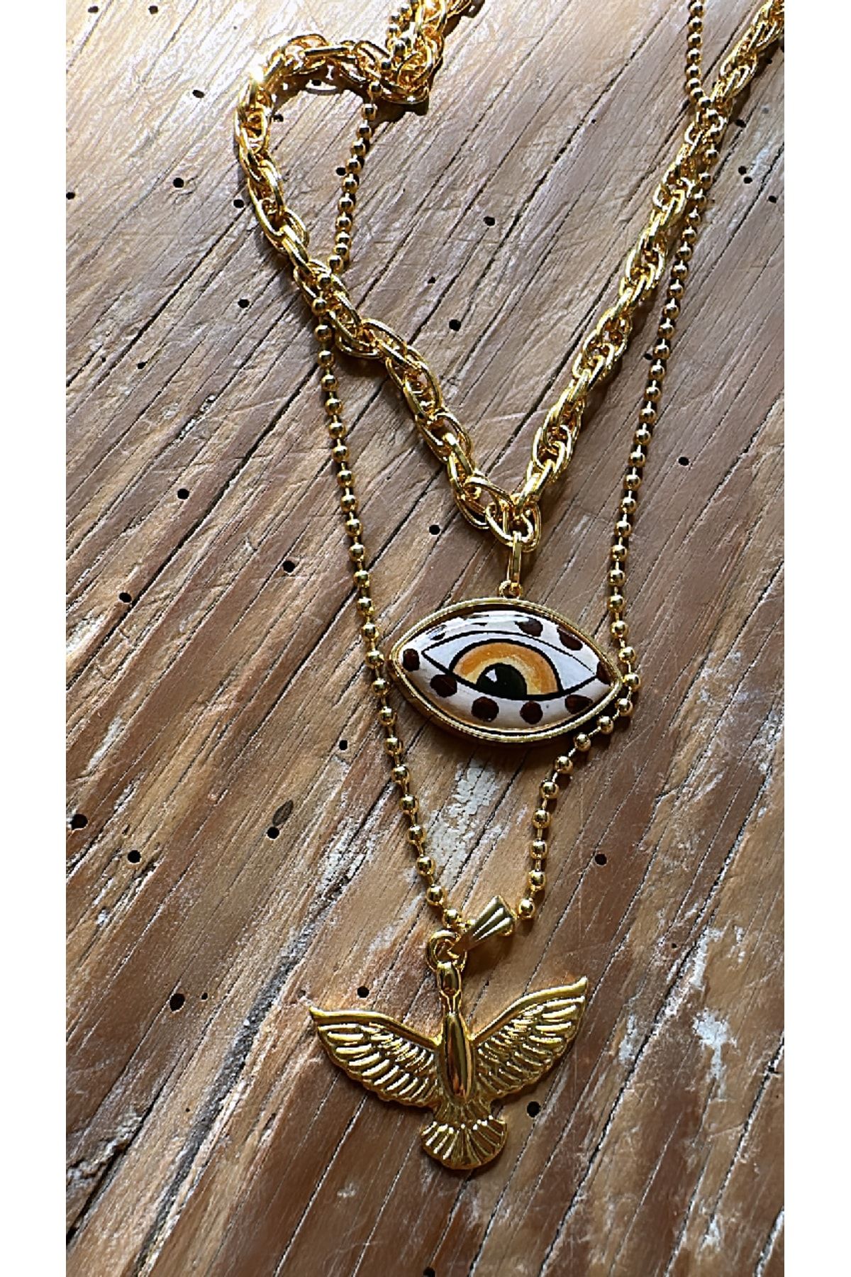 Gold top eye pendant