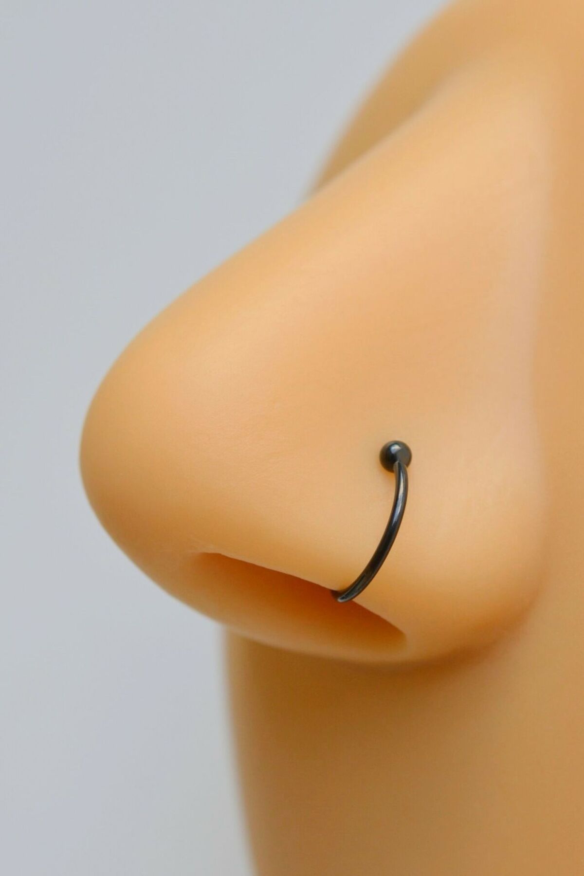 Black nose shop piercing stud