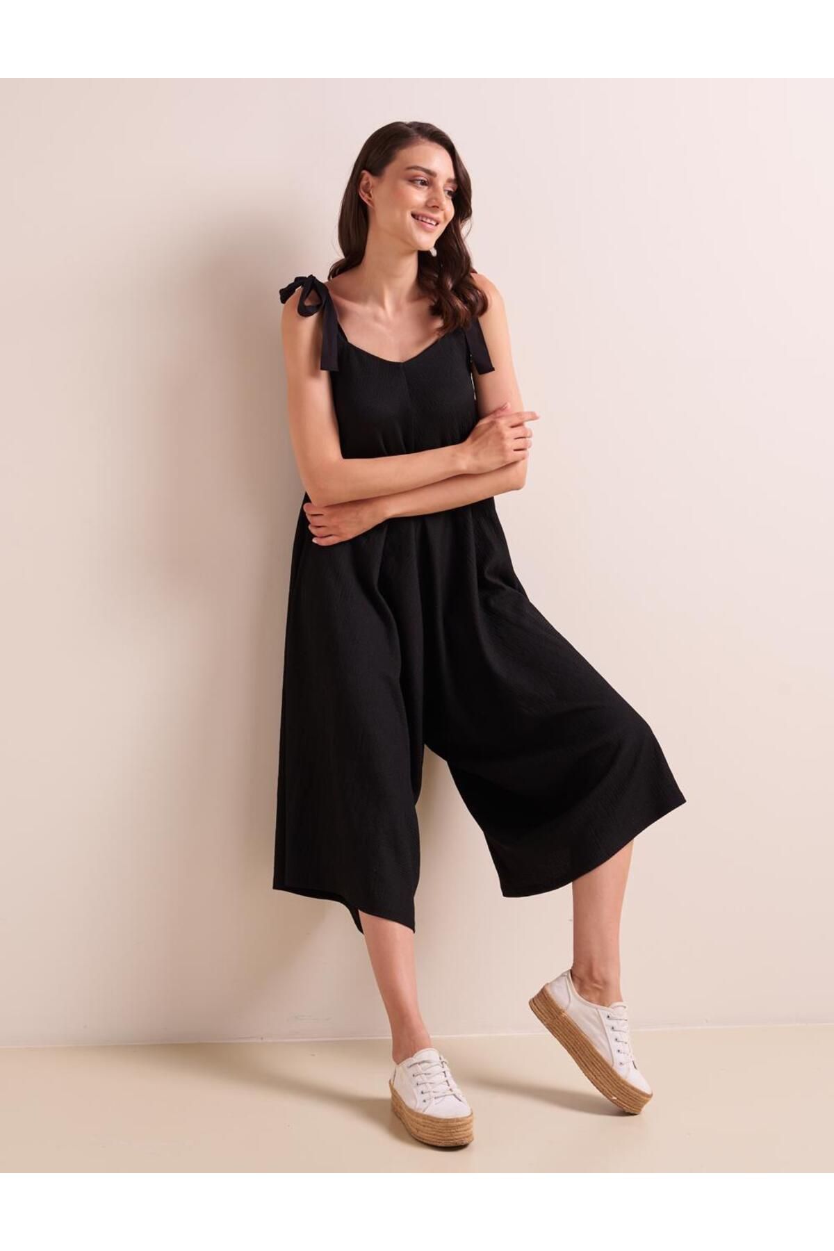 Black suspender jumpsuit discount